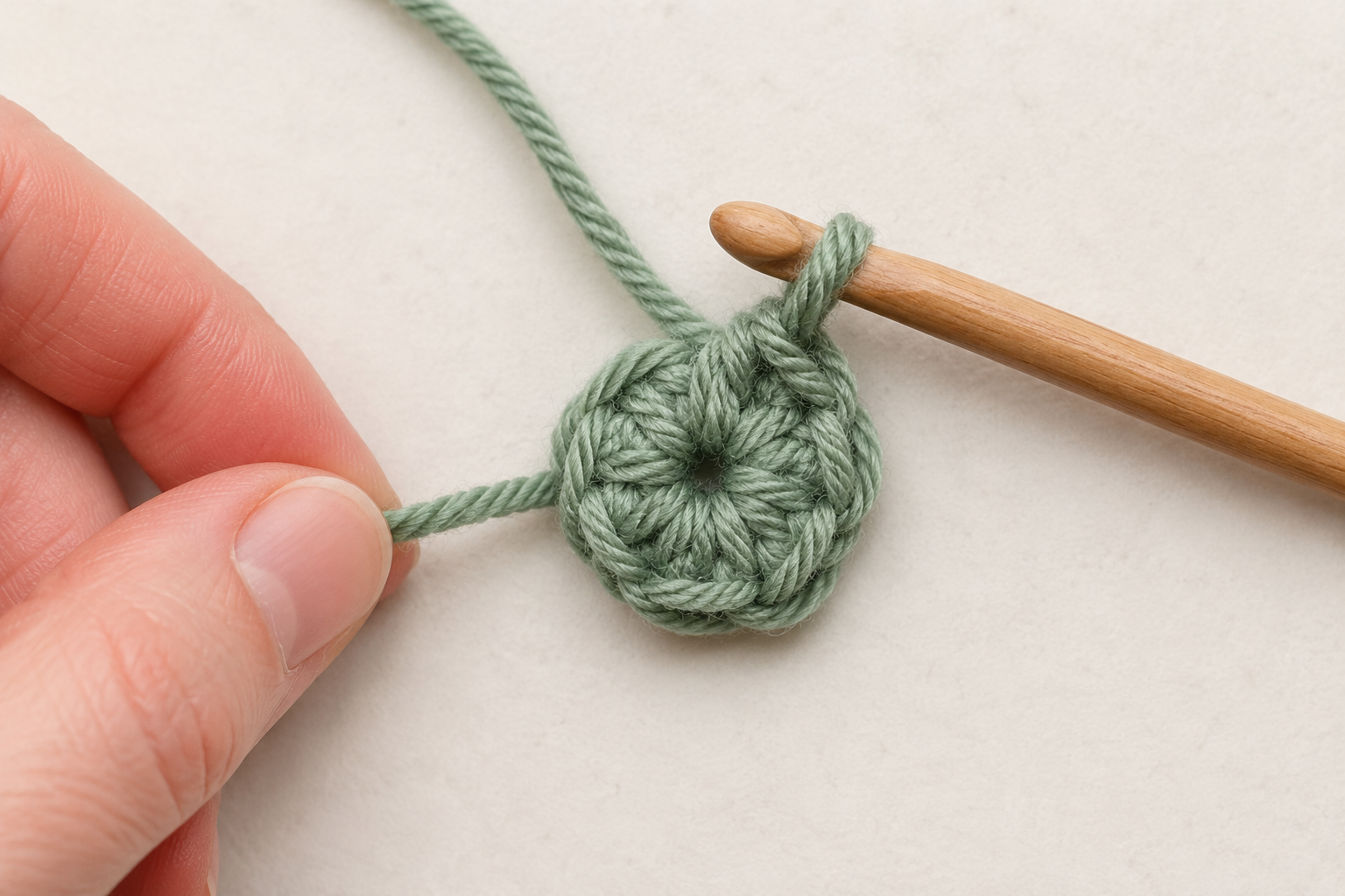Closing a crochet magic circle after making six single crochet stitches